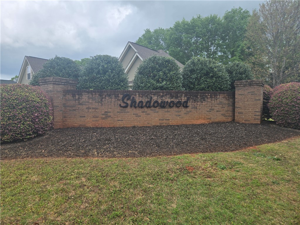 304 Knoll View Drive Seneca, SC 29678 - Photo 32 of 36 Welcome to Shadowood, a community featuring brick accents and lush landscaping.