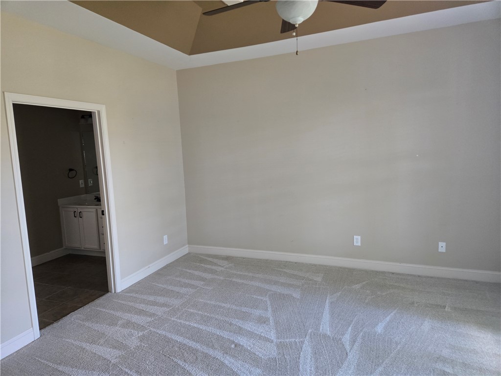 304 Knoll View Drive Seneca, SC 29678 - Photo 9 of 36 Generous bedroom features soft carpeting and a ceiling fan, offering a comfortable personal retreat.