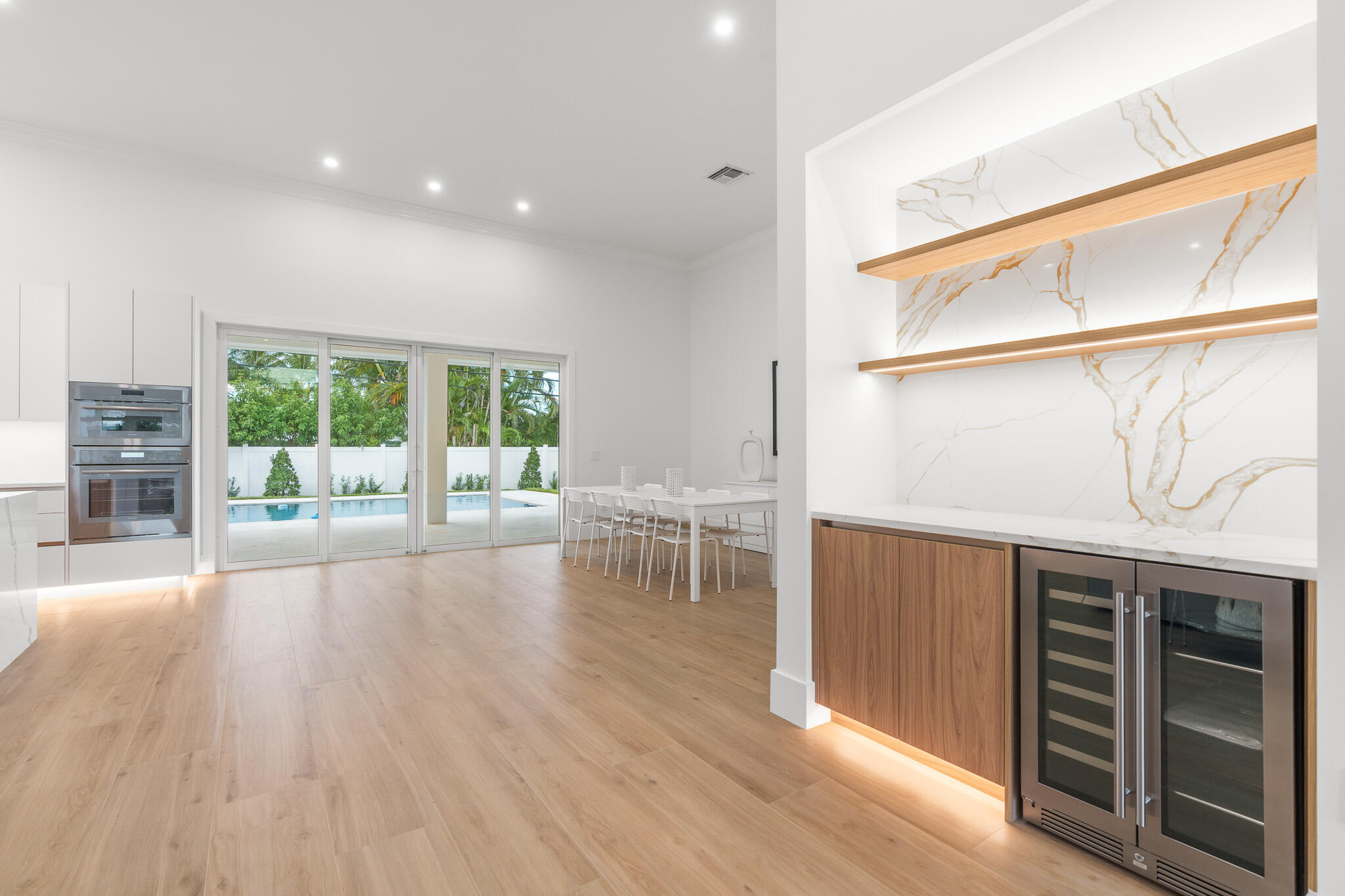 803 Sunset Road Boynton Beach, FL 33435 - Photo 13 of 57 a view of a hallway with wooden floor and fence