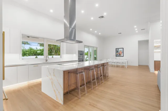 a kitchen with appliances cabinets and a sink