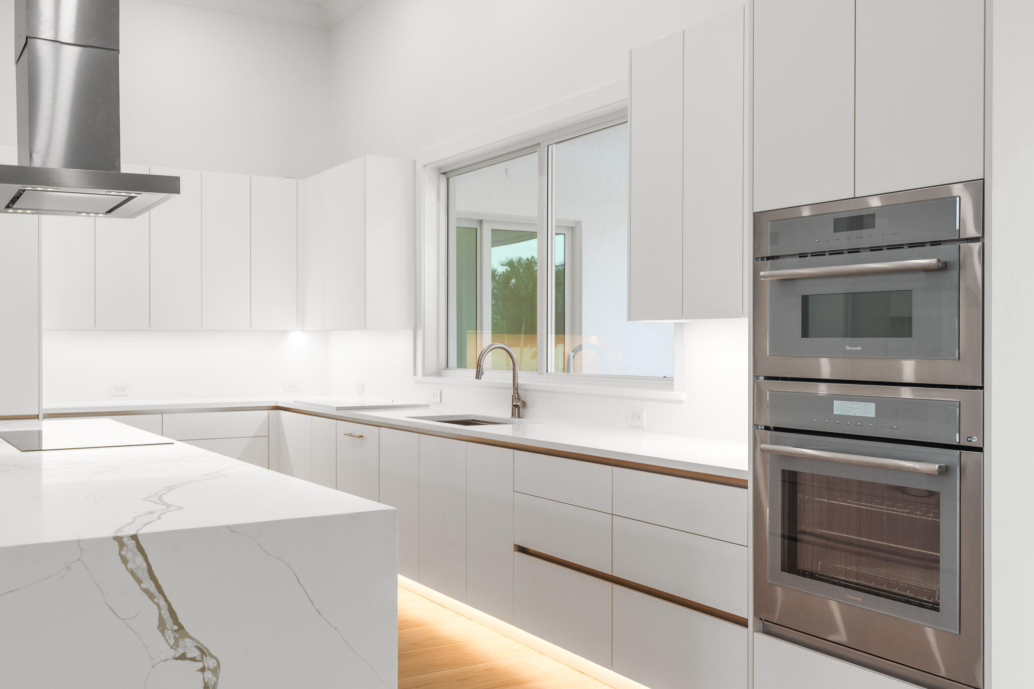 803 Sunset Road Boynton Beach, FL 33435 - Photo 17 of 57 a kitchen with appliances cabinets and a sink