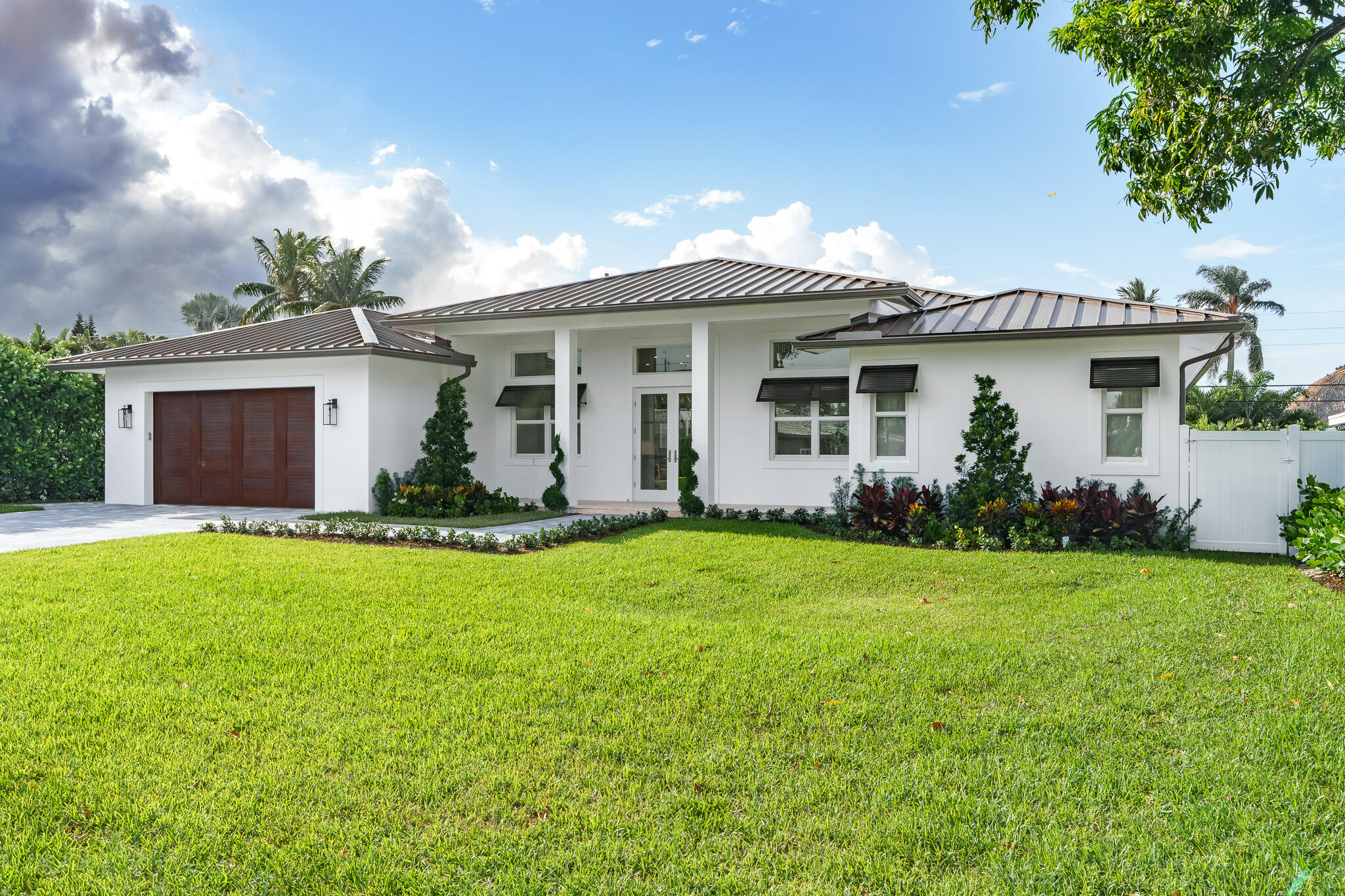 803 Sunset Road Boynton Beach, FL 33435 - Photo 2 of 57 a front view of house with yard and green space