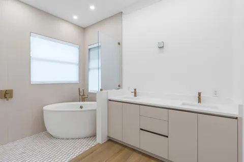 a view of a walk in closet and a living room