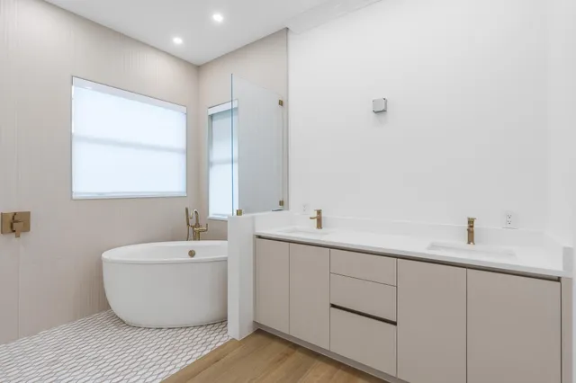 a view of a walk in closet and a living room