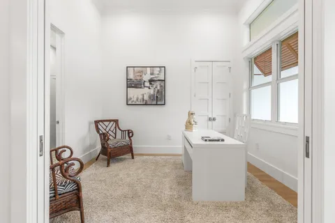 a view of a storage and utility room with washer and dryer