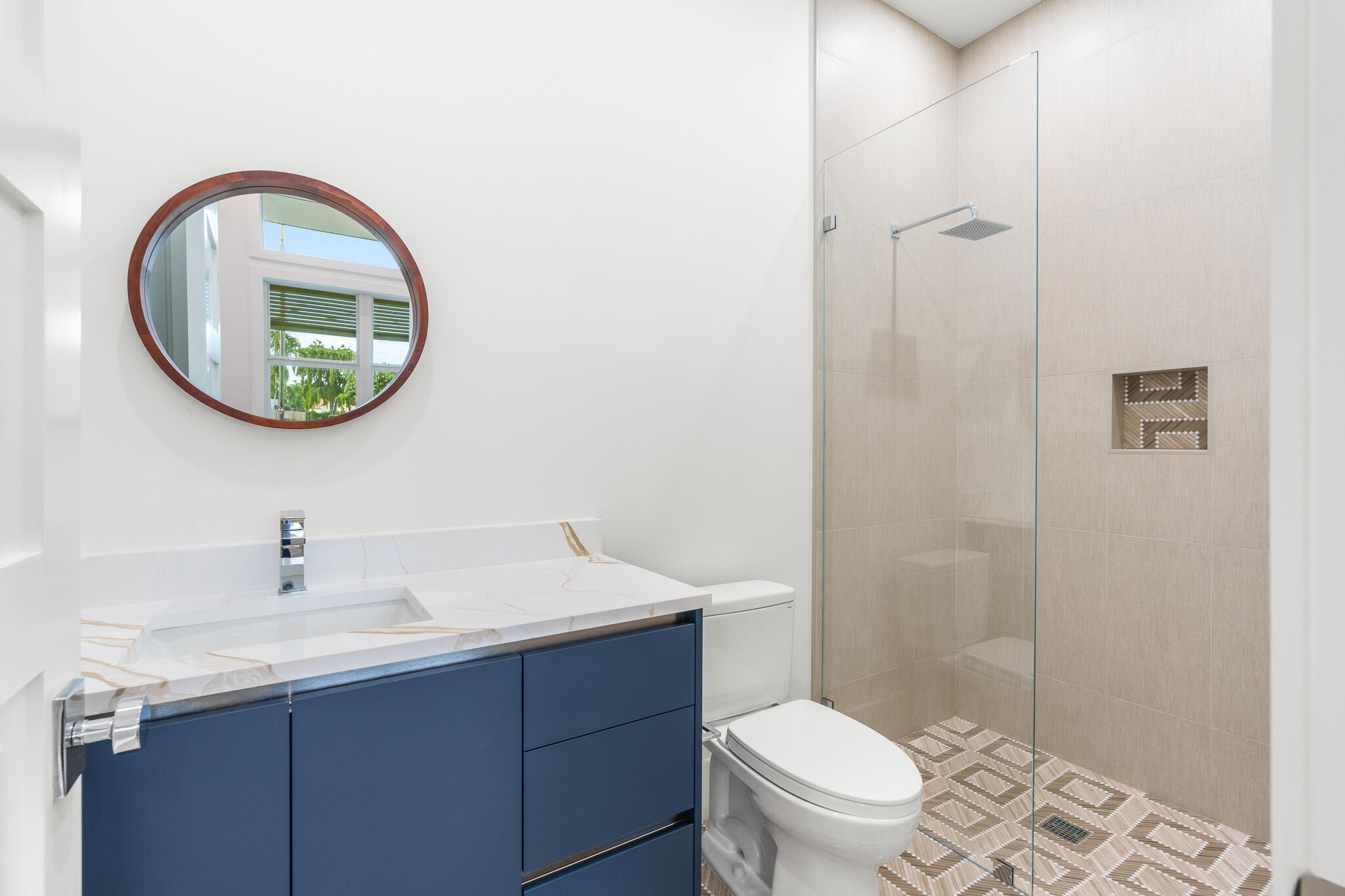 803 Sunset Road Boynton Beach, FL 33435 - Photo 36 of 57 a bathroom with a toilet a sink and a mirror