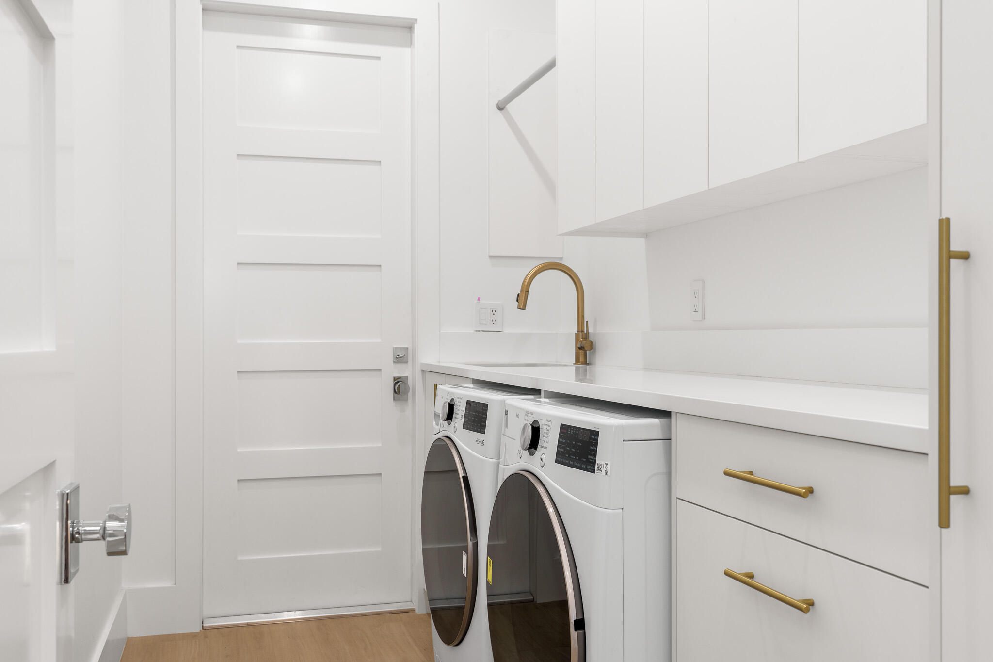 803 Sunset Road Boynton Beach, FL 33435 - Photo 39 of 57 a view of a storage and utility room with washer and dryer