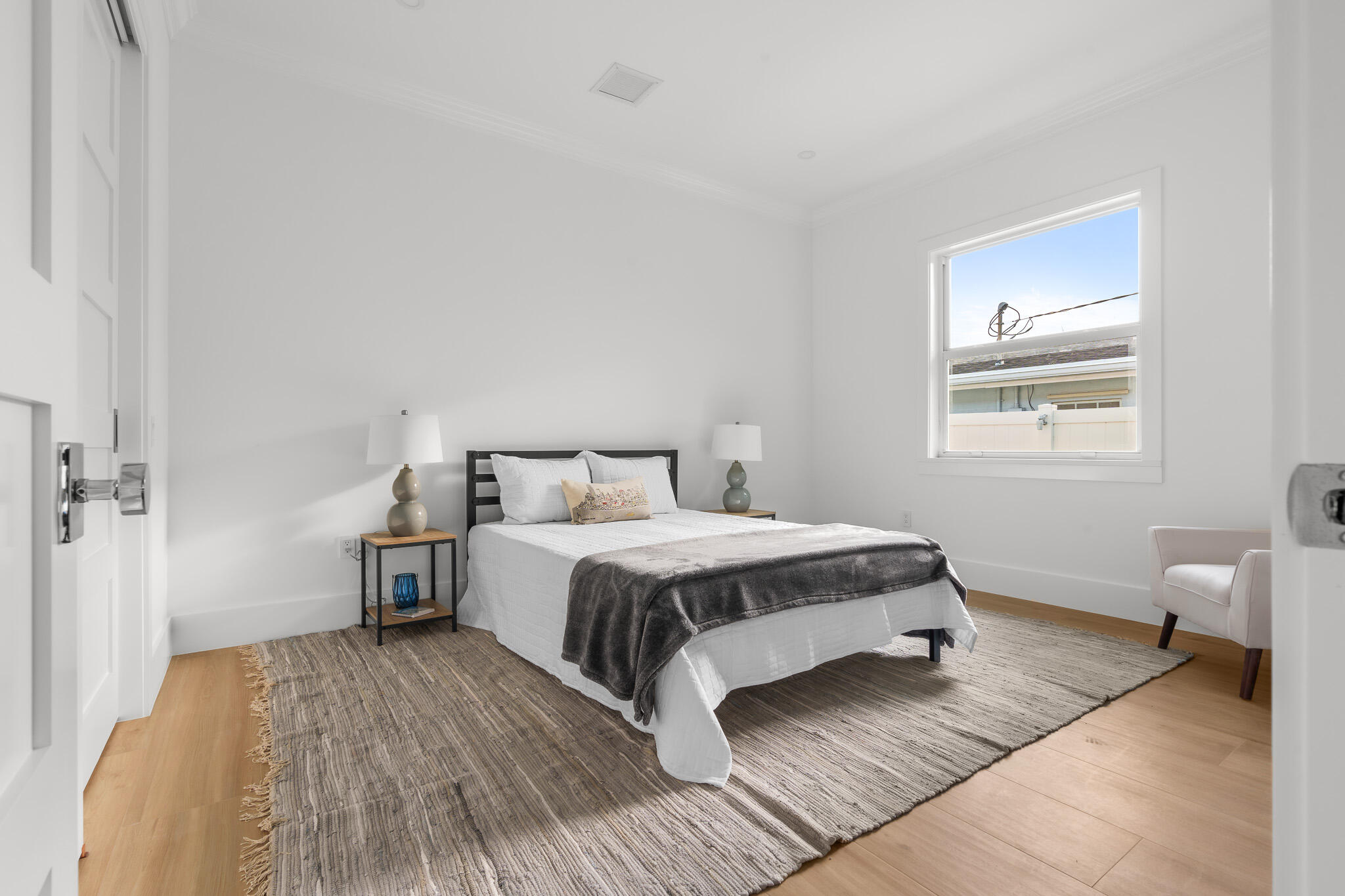 803 Sunset Road Boynton Beach, FL 33435 - Photo 41 of 57 a bedroom with a bed and wooden floor