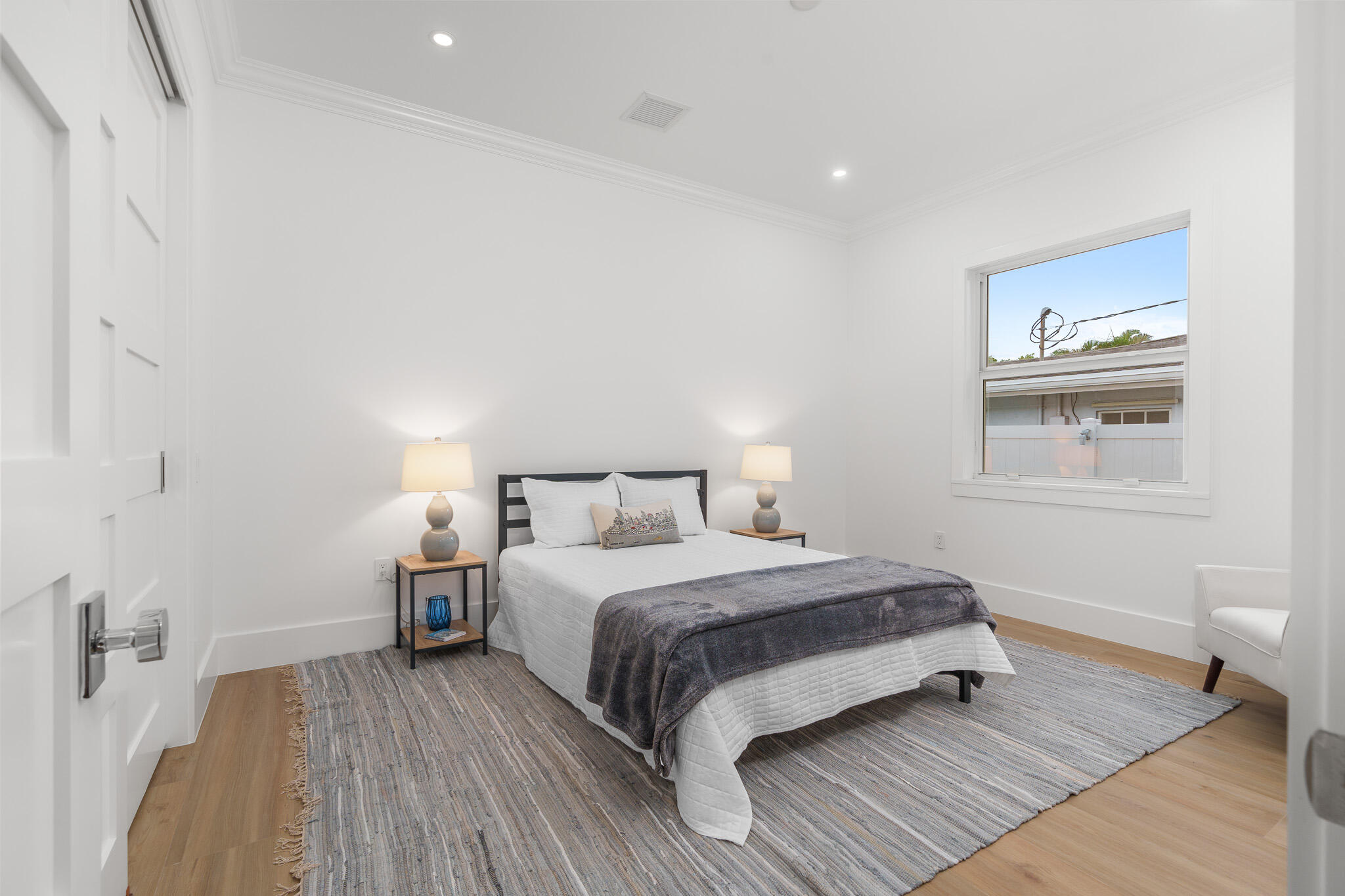 803 Sunset Road Boynton Beach, FL 33435 - Photo 42 of 57 a bedroom with a bed and a window