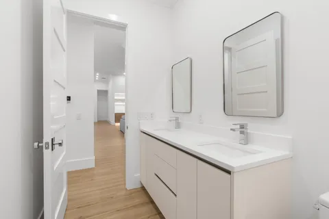 a bathroom with a glass shower door