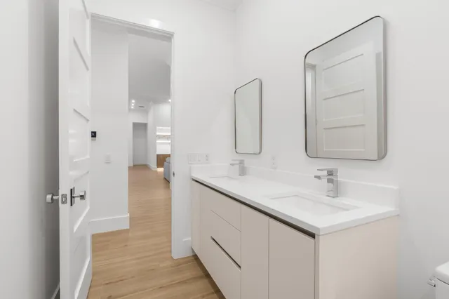 a bathroom with a glass shower door