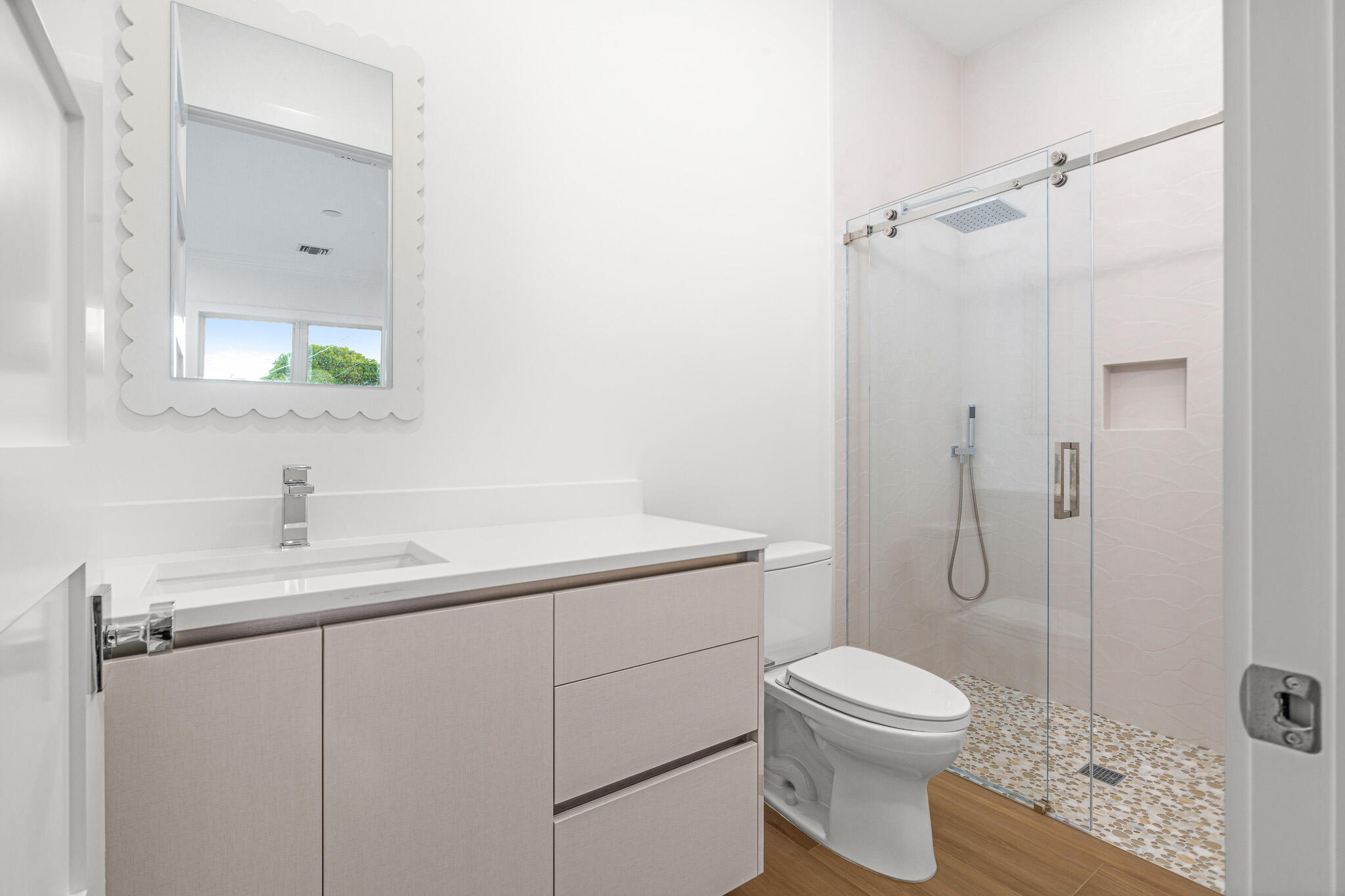 803 Sunset Road Boynton Beach, FL 33435 - Photo 49 of 57 a bathroom with a granite countertop toilet sink and mirror