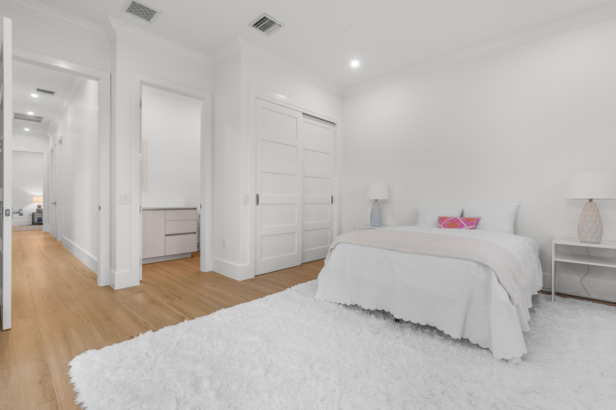 803 Sunset Road Boynton Beach, FL 33435 - Photo 53 of 57 a spacious bedroom with a bed and a table