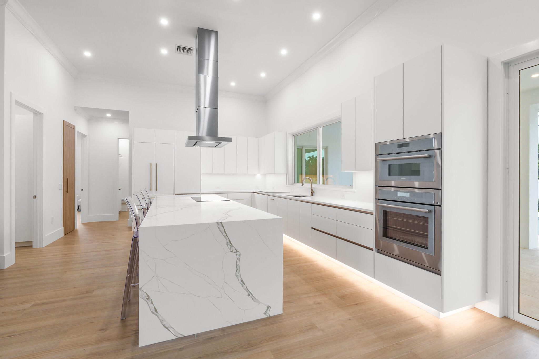 803 Sunset Road Boynton Beach, FL 33435 - Photo 10 of 57 a large kitchen with stainless steel appliances kitchen island granite countertop a refrigerator and a stove top oven