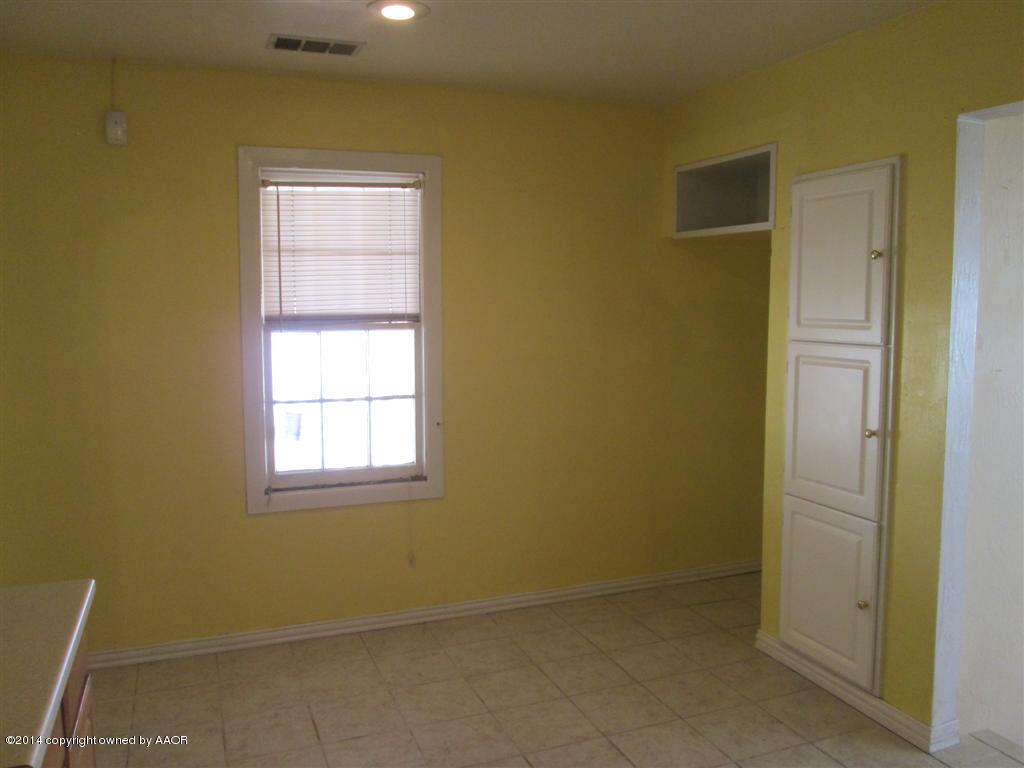 4017 Bowie Street Amarillo, TX 79110 - Photo 14 of 34 an empty room with windows