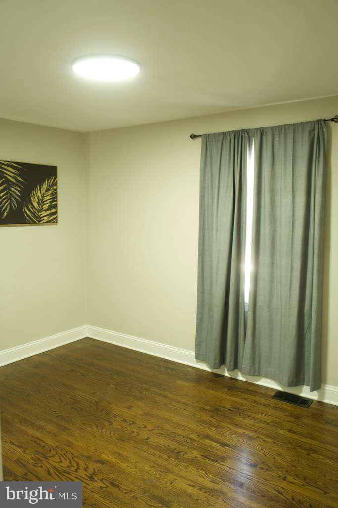 133 Heulings Avenue Riverside, NJ 08075 - Photo 14 of 31 a view of room with window and wooden floor