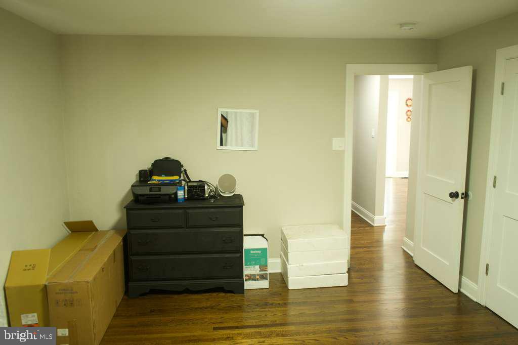 133 Heulings Avenue Riverside, NJ 08075 - Photo 15 of 31 a room with a couch and wooden floor
