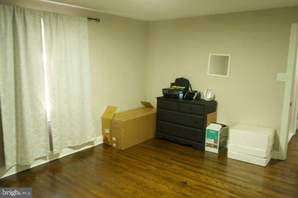 133 Heulings Avenue Riverside, NJ 08075 - Photo 16 of 31 a living room with furniture and wooden floor