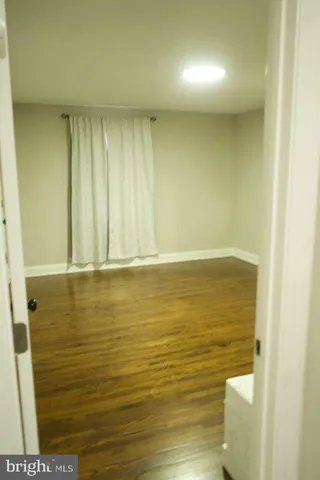 a close view of a utility room with dryer and washer