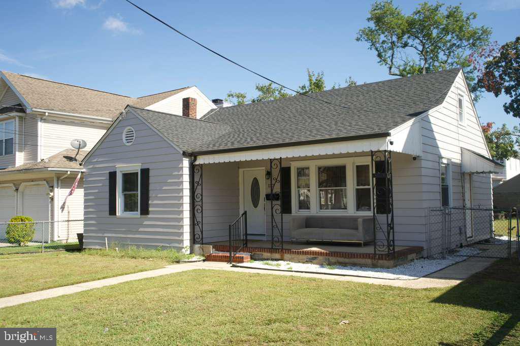 133 Heulings Avenue Riverside, NJ 08075 - Photo 2 of 31 a front view of a house with garden