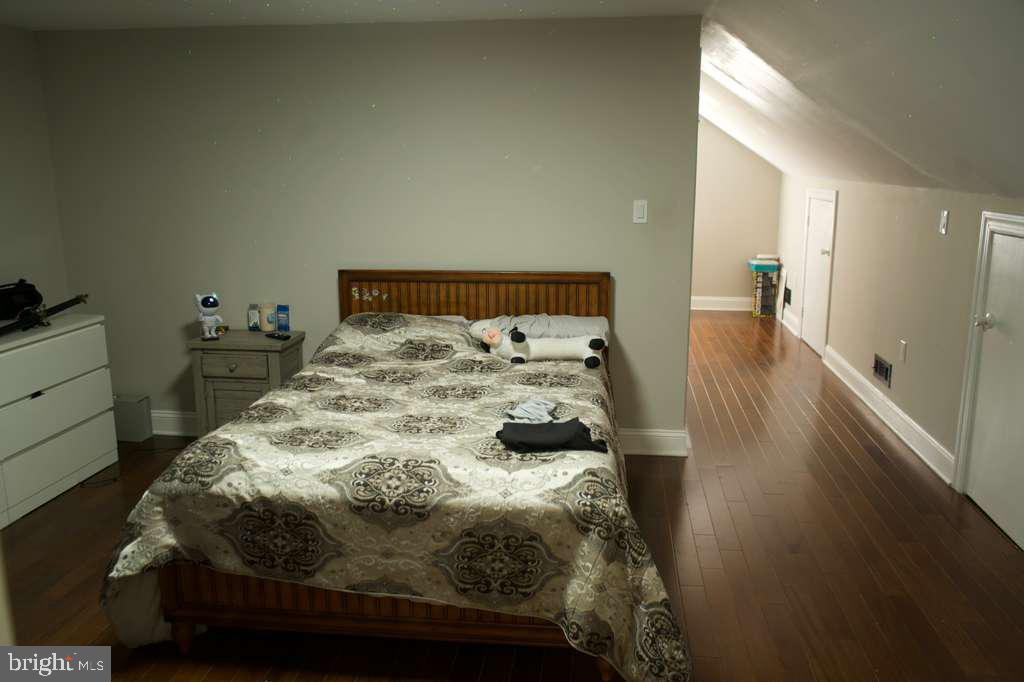 133 Heulings Avenue Riverside, NJ 08075 - Photo 23 of 31 a bed sitting in a bedroom next to a window