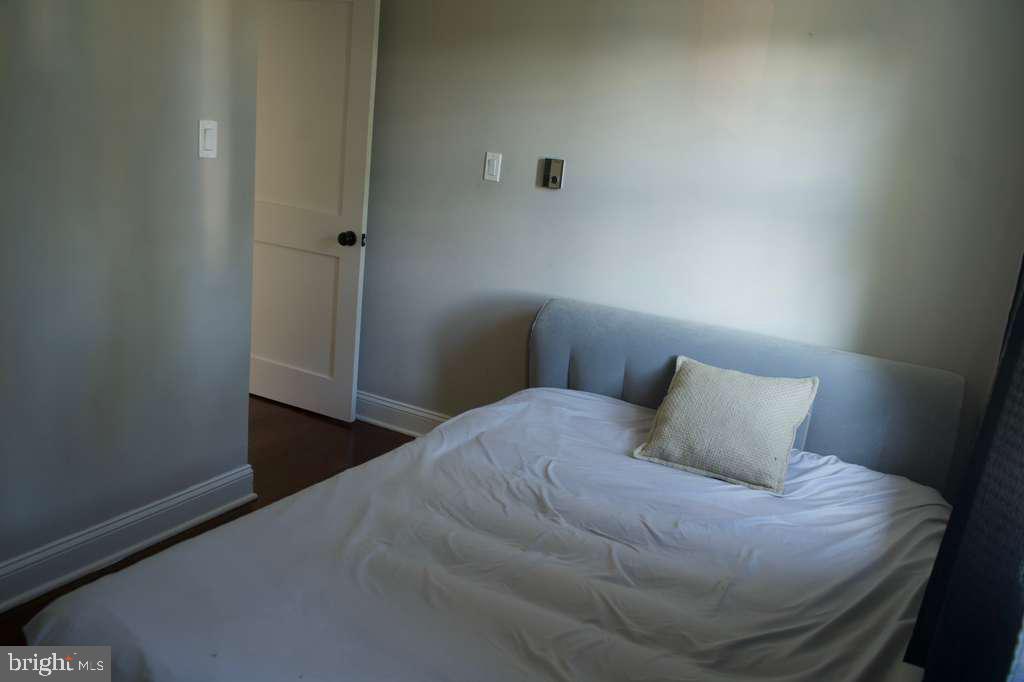 133 Heulings Avenue Riverside, NJ 08075 - Photo 26 of 31 a bedroom with a bed and wooden floor