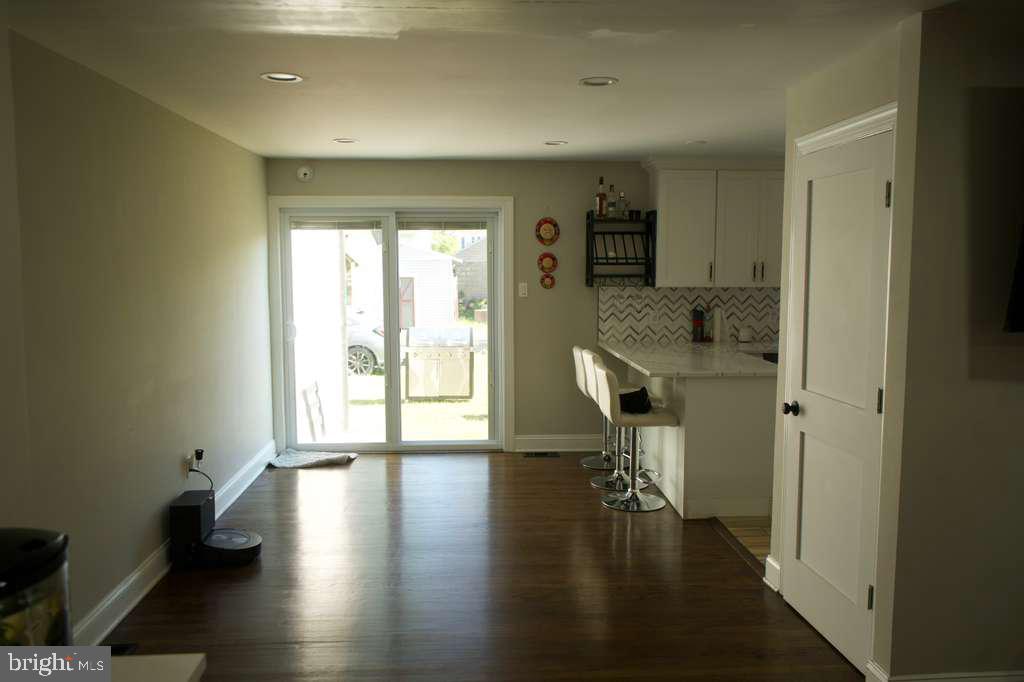 133 Heulings Avenue Riverside, NJ 08075 - Photo 7 of 31 wooden floor in an empty room with a window