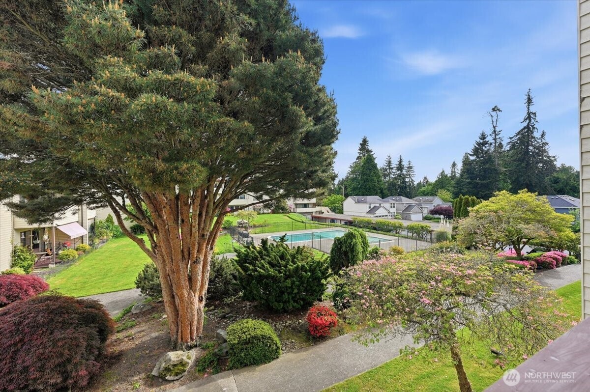 8516 196th Street Southwest, Unit 204 Edmonds, WA 98026 - Photo 12 of 16 a view of a garden with a fountain