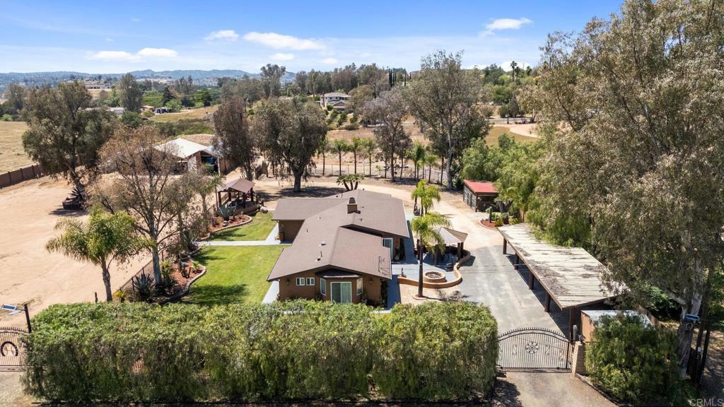 30265 Miller Road Valley Center, CA 92082 - Photo 44 of 56 a view of a house with a yard and lake view