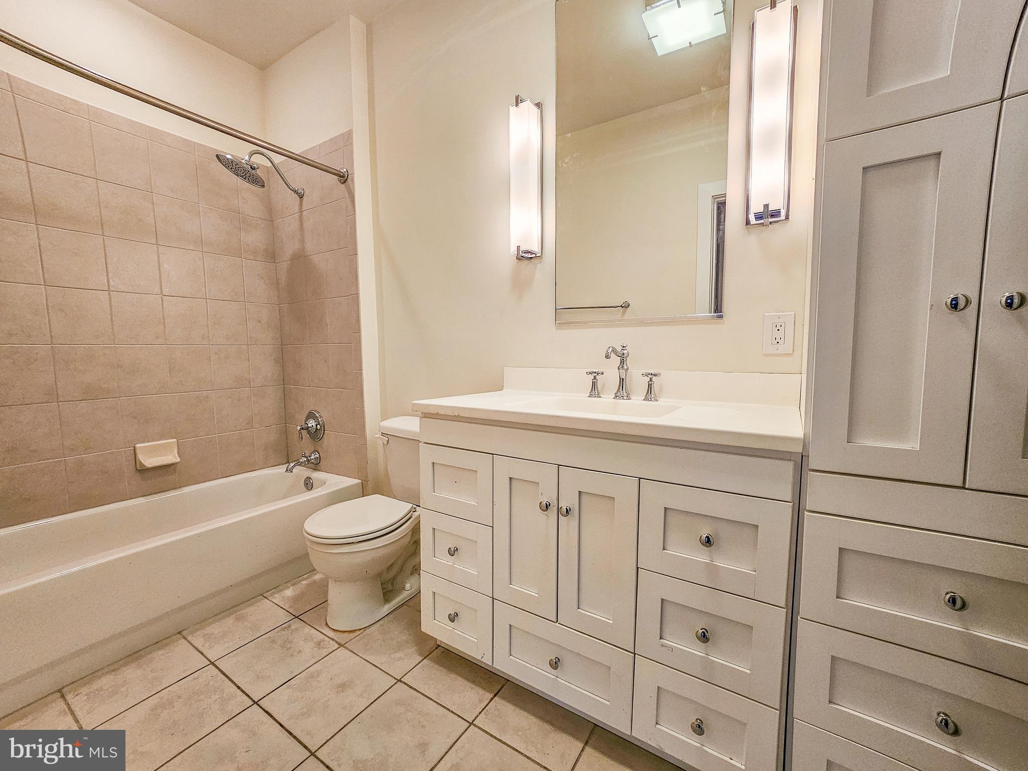 2007 Clipper Park Road, Unit 117 Baltimore, MD 21211 - Photo 11 of 30 a bathroom with a sink a toilet and bathtub