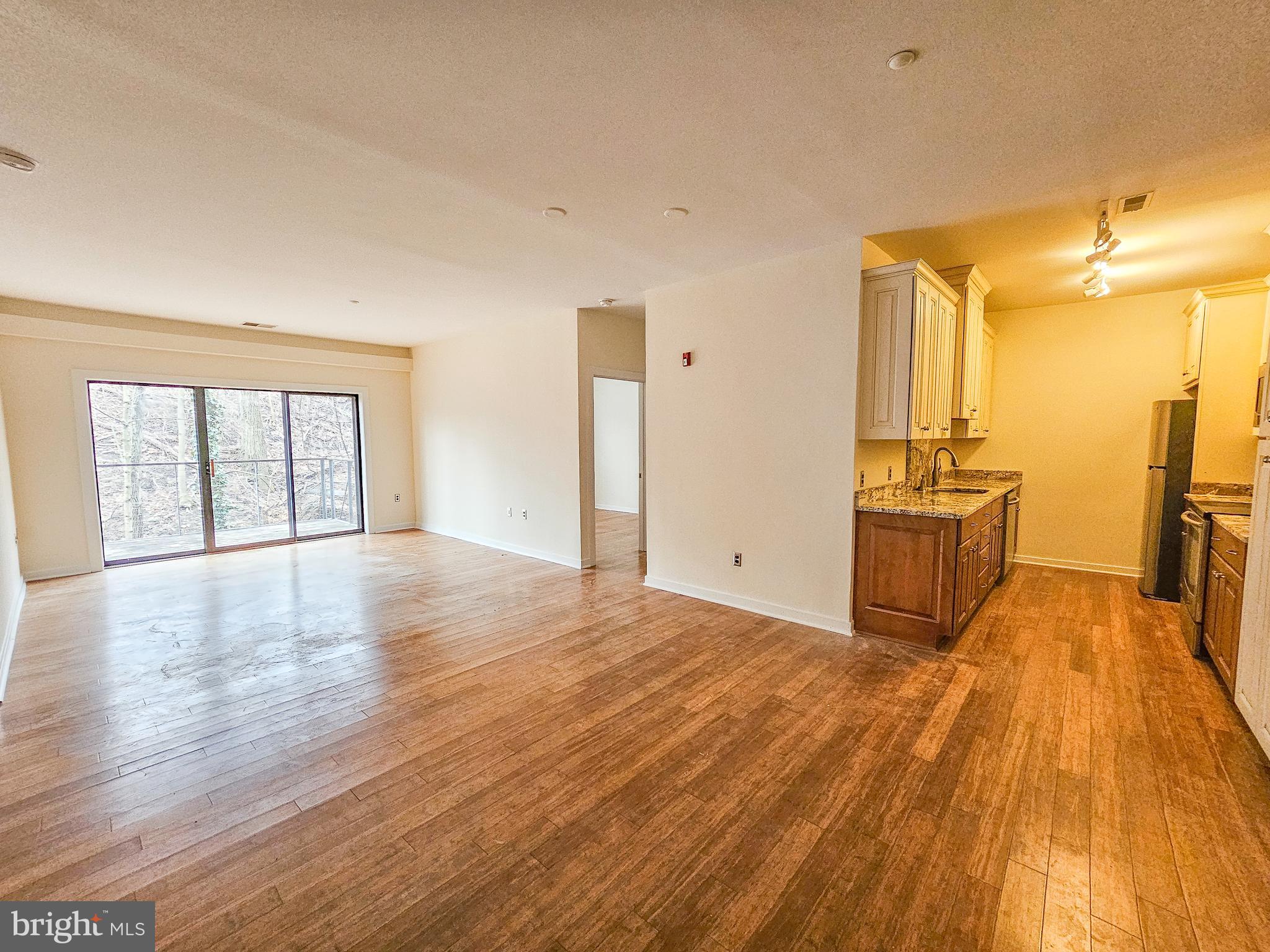 2007 Clipper Park Road, Unit 117 Baltimore, MD 21211 - Photo 2 of 30 a view of a kitchen with wooden floor and a sink