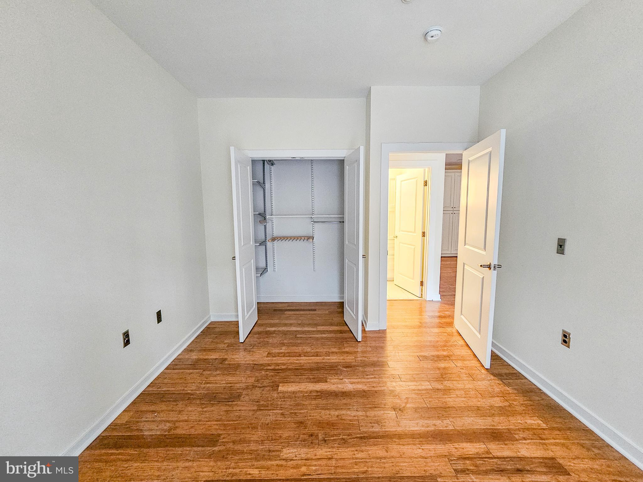 2007 Clipper Park Road, Unit 117 Baltimore, MD 21211 - Photo 10 of 30 a view of an empty room with wooden floor