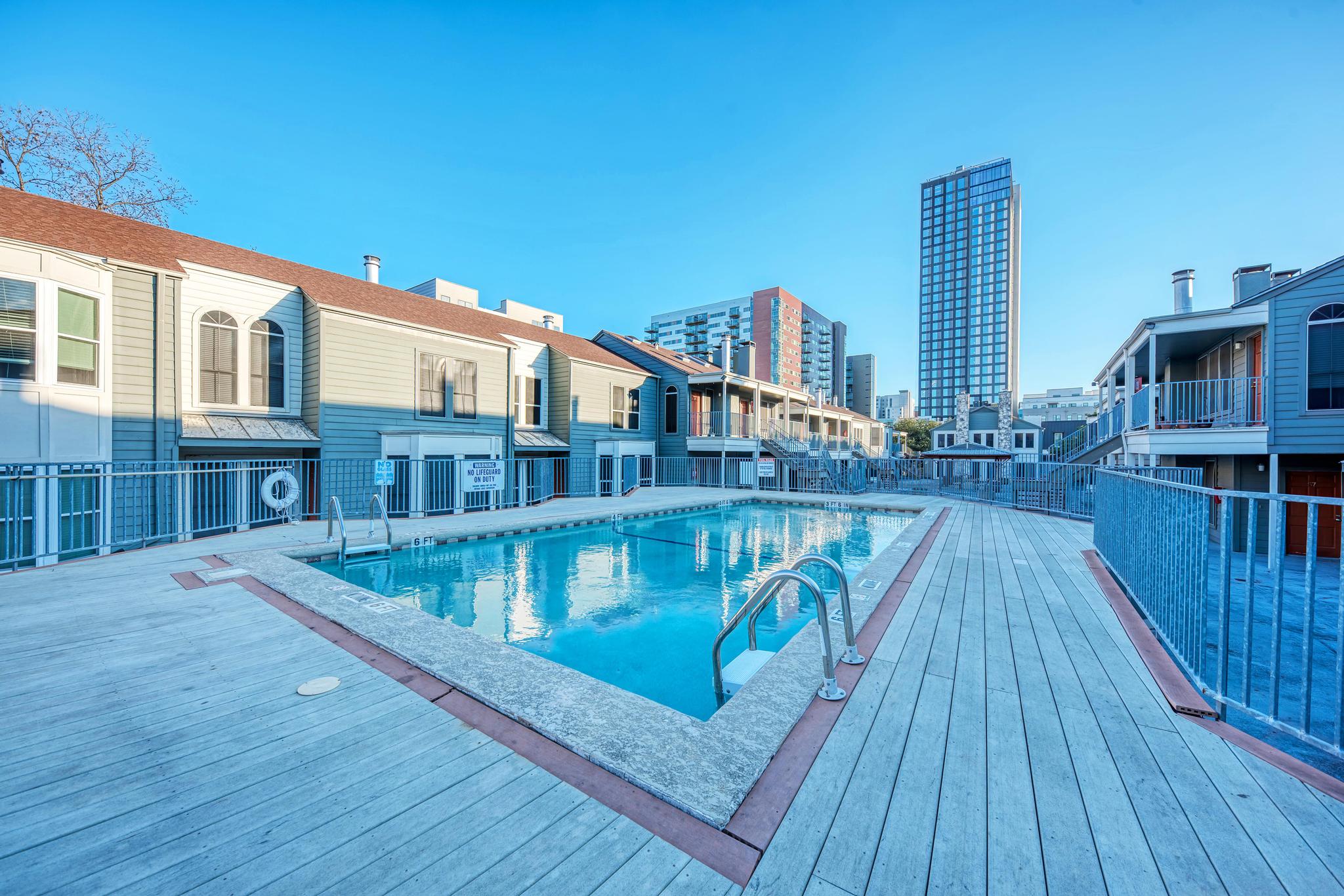 2529 Rio Grande Street, Unit 100 Austin, TX 78705 - Photo 9 of 14 a view of balcony with hardwood floor and city view