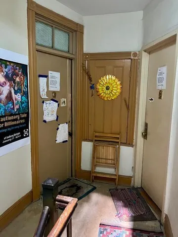 a room with painting and a table