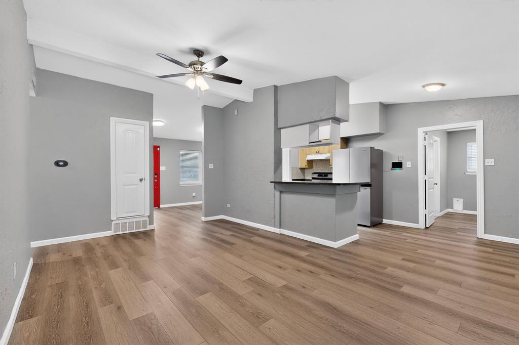 2309 Fyke Road Carrollton, TX 75006 - Photo 12 of 40 Open-concept living area featuring wood-finish flooring, recessed lighting, and a ceiling fan