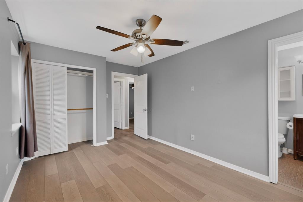 2309 Fyke Road Carrollton, TX 75006 - Photo 20 of 40 Spacious room featuring wood-finish flooring, a ceiling fan with integrated lighting, and a closet with louvered bi-fold doors