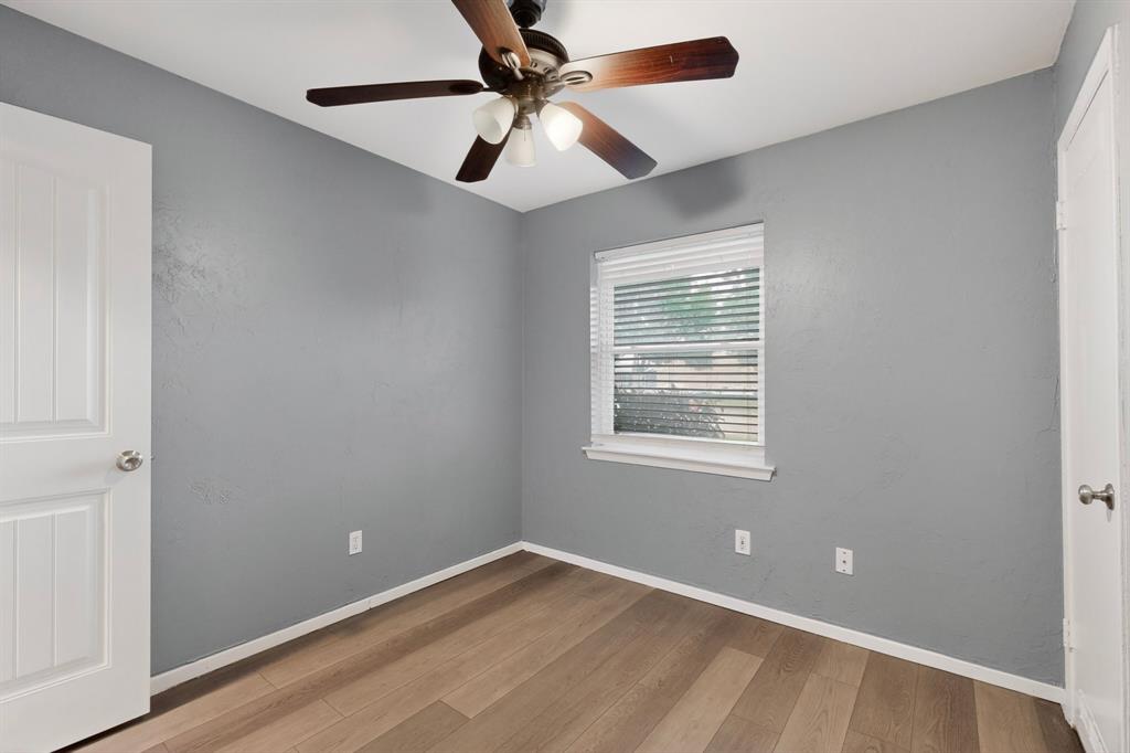 2309 Fyke Road Carrollton, TX 75006 - Photo 30 of 40 Light wood-finish flooring with neutral gray walls and white trim