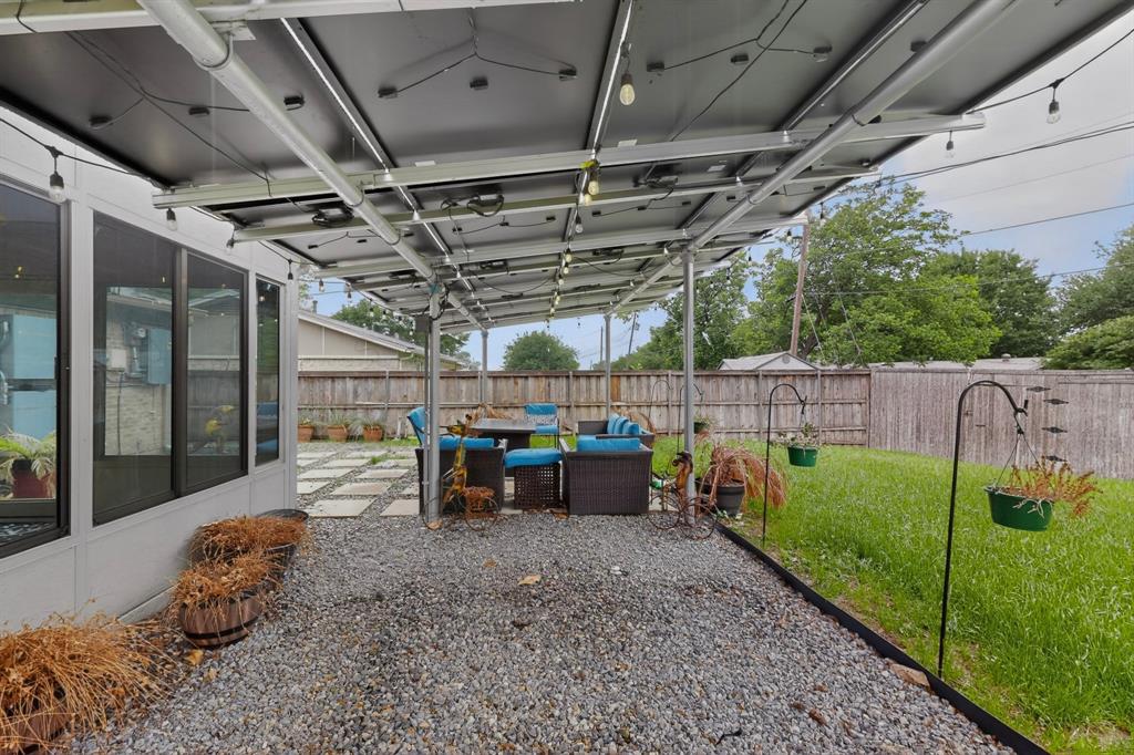 2309 Fyke Road Carrollton, TX 75006 - Photo 38 of 40 Covered patio featuring a gravel surface and string lighting