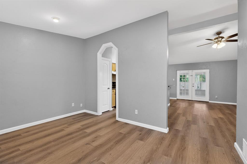 2309 Fyke Road Carrollton, TX 75006 - Photo 8 of 40 Interior space featuring wood-finish flooring, light gray walls, white trim, and a recessed ceiling light