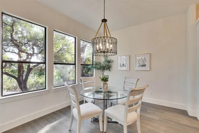 a kitchen with stainless steel appliances kitchen island granite countertop a sink and cabinets