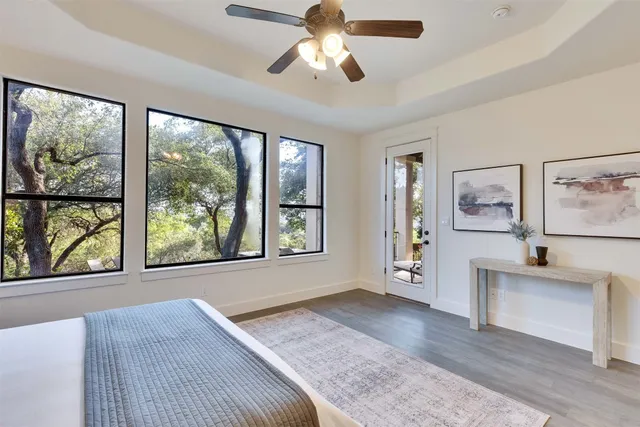 a bathroom with a granite countertop sink a light fixture and a mirror