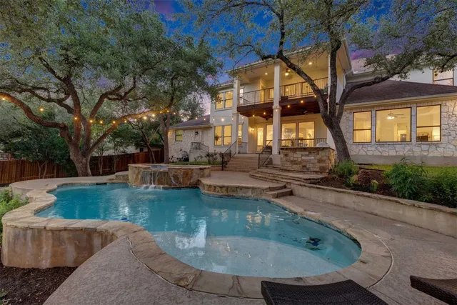 a view of a house with swimming pool