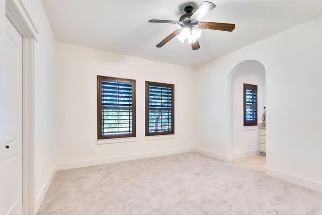 a bathroom with a sink a toilet a tub and shower