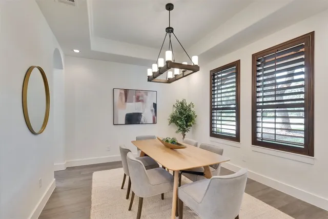 a living room with furniture fireplace and a large window