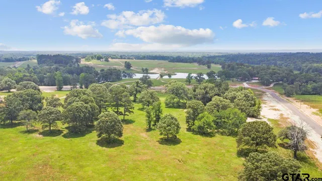 a view of a lake with a yard