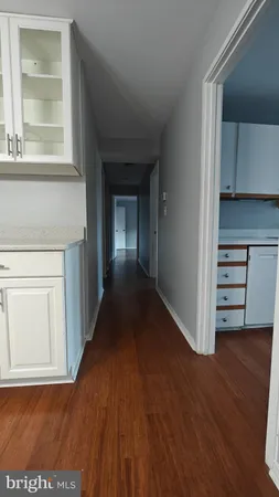 a view of cabinets and wooden floor