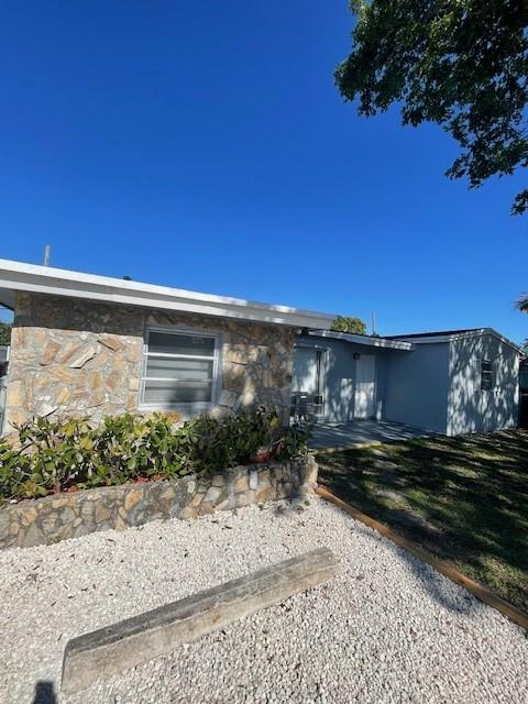a view of a backyard of the house