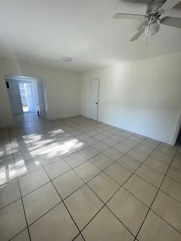 a view of a livingroom and window