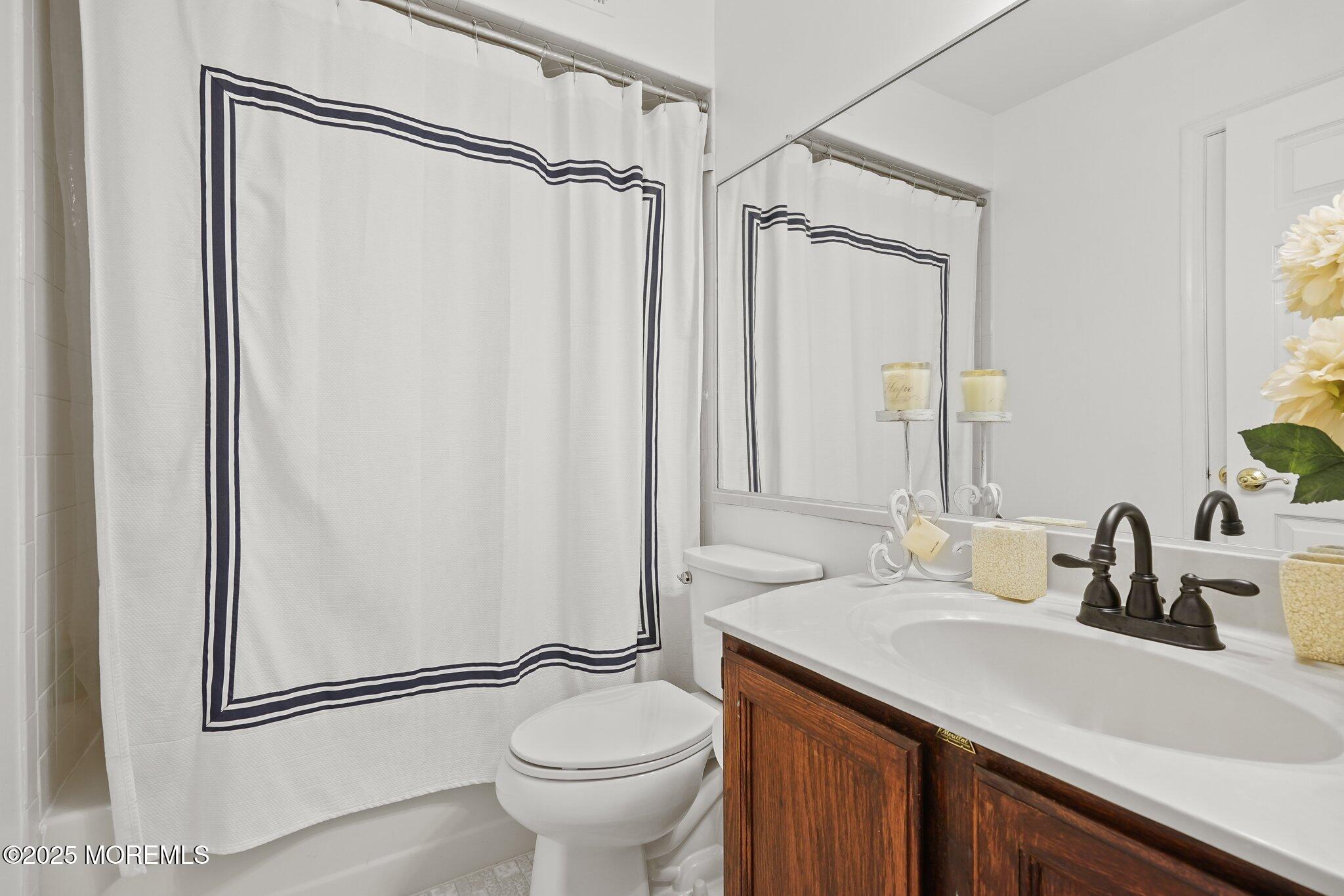38 Sweet Gum Road Howell, NJ 07731 - Photo 12 of 23 a bathroom with a granite countertop sink toilet and shower