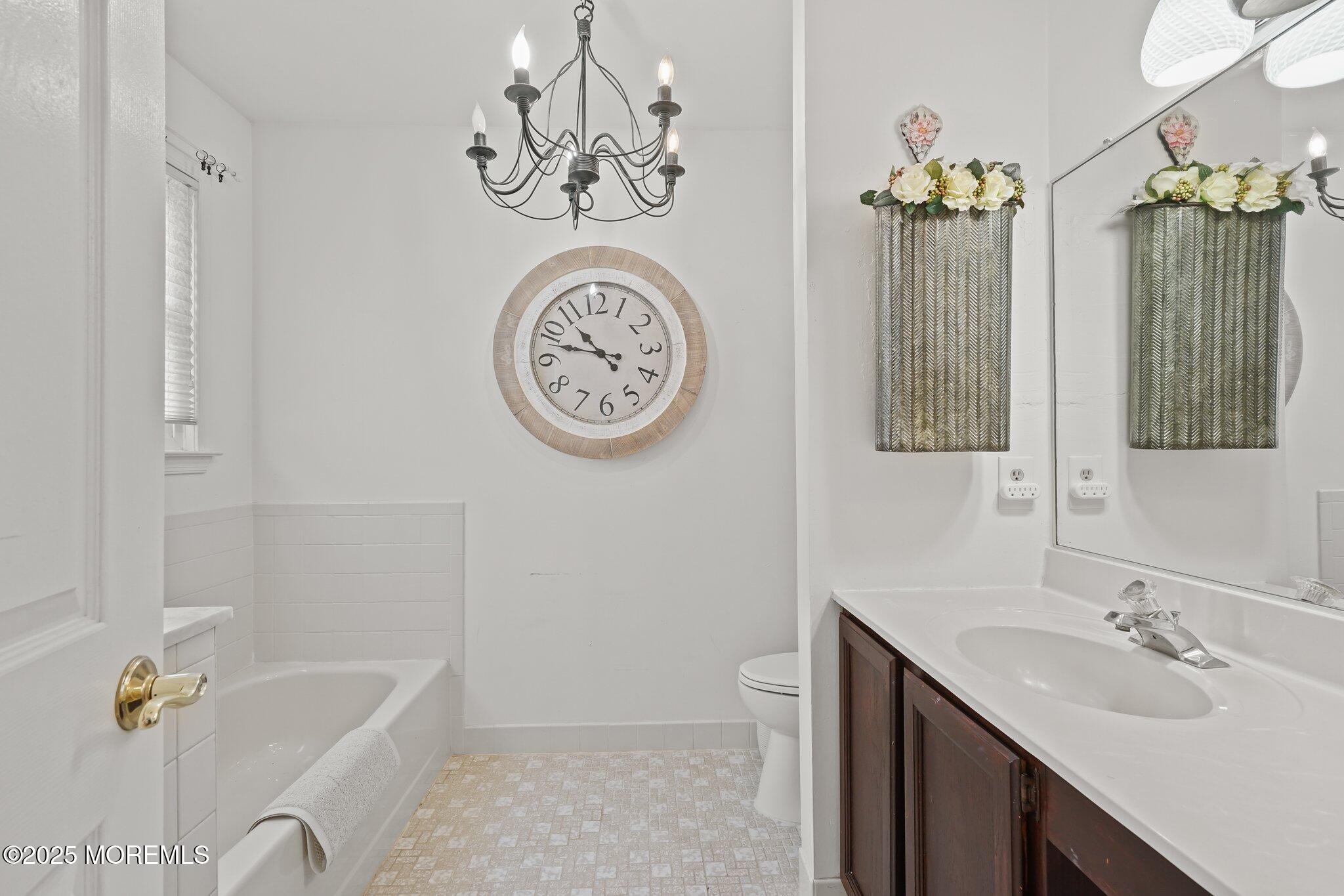 38 Sweet Gum Road Howell, NJ 07731 - Photo 8 of 23 a bathroom with a sink a toilet and shower